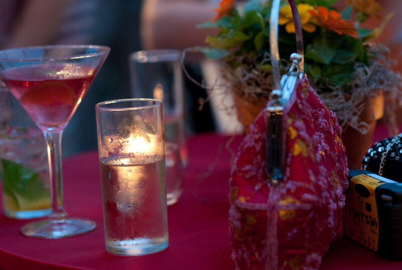 Glasses and purse on table with flower decorations