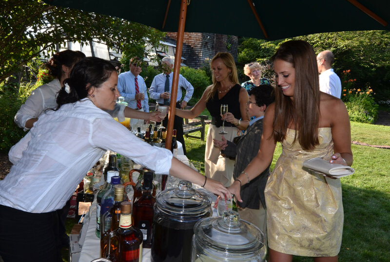 Bar tender serving woman in gold dress