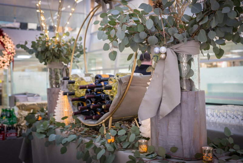 Wine bottles in basket with flower decorations