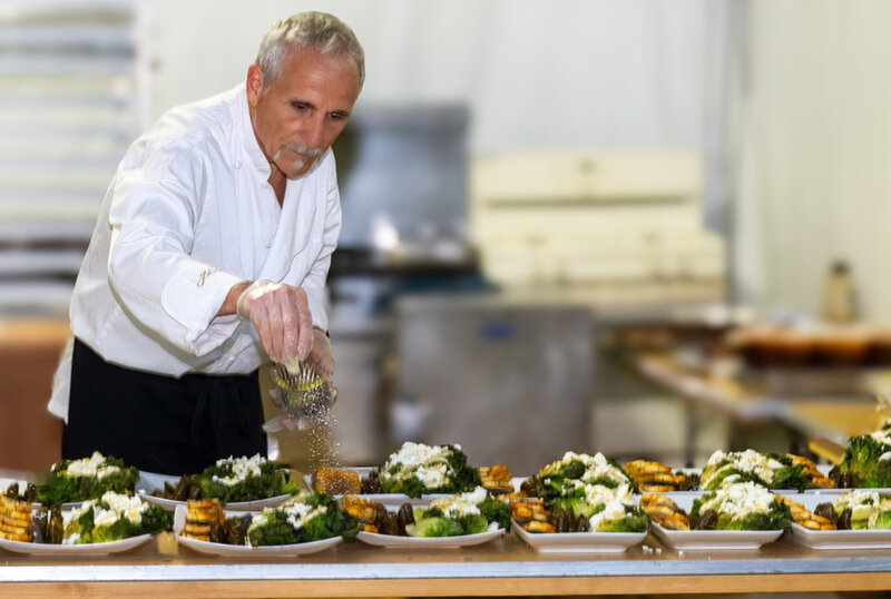Chef Giorgio garnishing salads