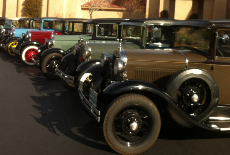 Line of a variety of classic cars