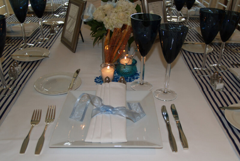Table setting with wine glasses and candle decorations