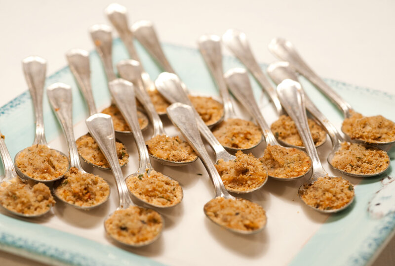 Spoons with breaded clams on spoons