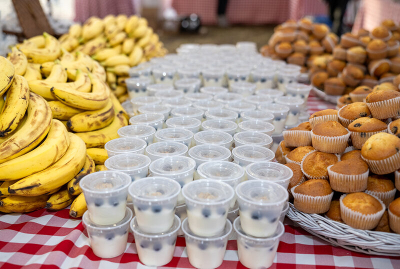 Bananas, yogurt and muffins on table