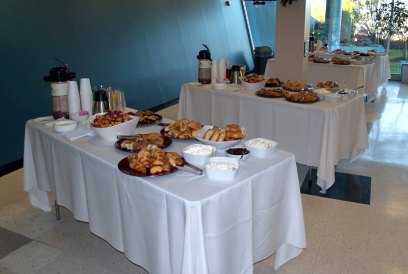 Tables with baked goods and coffee station
