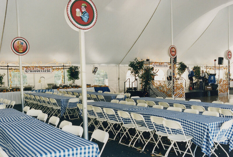 Long tables with many seats with Oktoberfest decorations