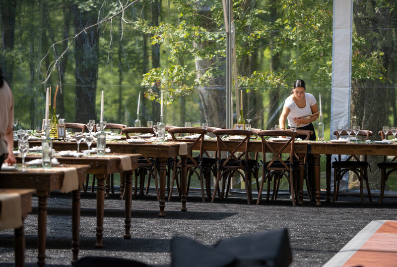 Staff setting up tables for wedding