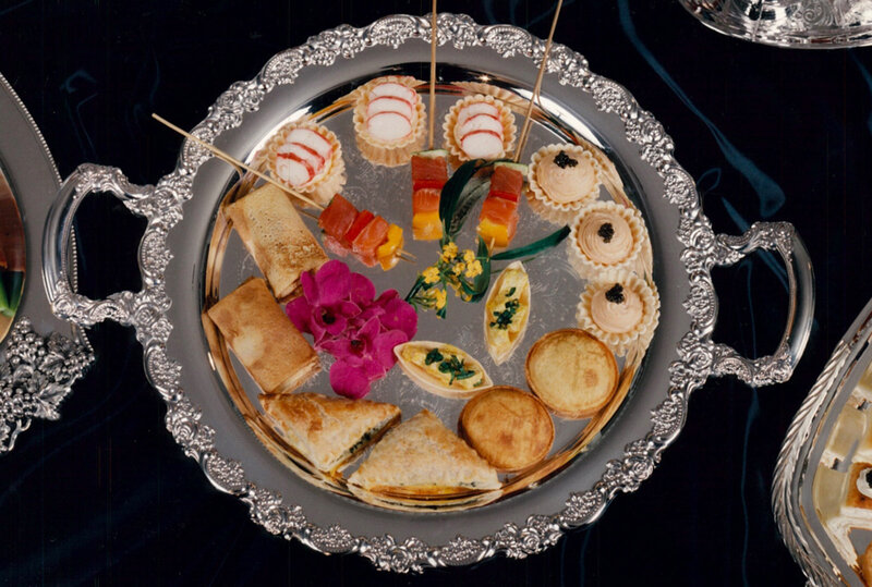 Round silver serving tray with appetizers